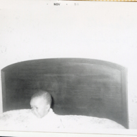MAF0314_photograph-of-a-baby-in-a-bed.jpg